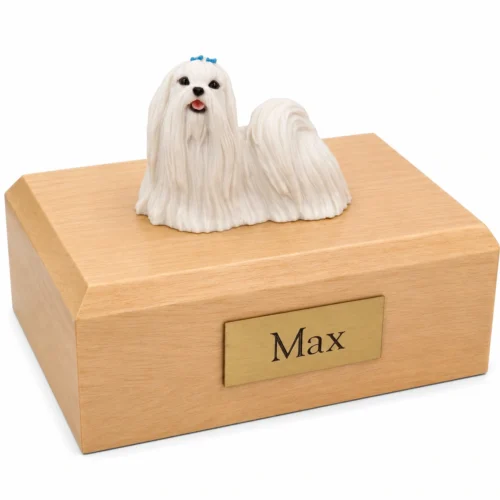 Memorial cremation urn with standing Maltese dog figurine, maple finish