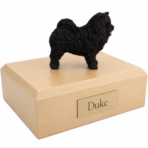 Memorial cremation urn with standing black Chow Chow dog figurine, maple finish