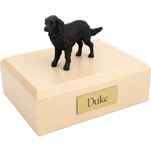 Memorial cremation urn with standing Flat Coated Retriever dog figurine, maple finish