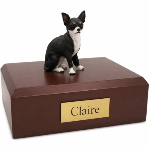 Memorial cremation urn with sitting black and white Chihuahua dog figurine, walnut finish