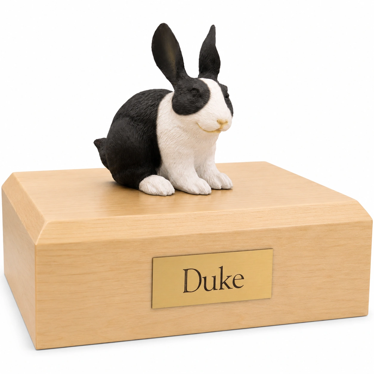 Memorial cremation urn with black and white rabbit figurine, maple finish