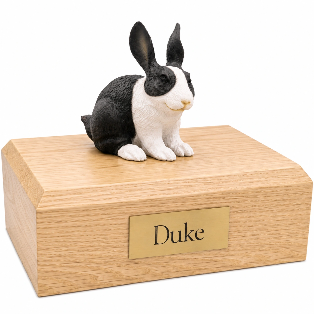 Memorial cremation urn with black and white rabbit figurine, oak finish