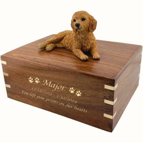 Memorial cremation urn with laying Goldendoodle dog figurine, rosewood with brass corner inlays, engraved wood with gold fill